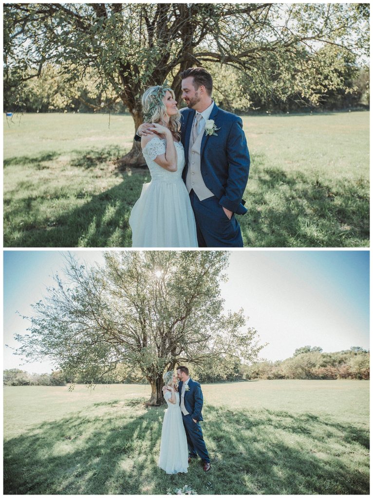 groom embracing his bride outside