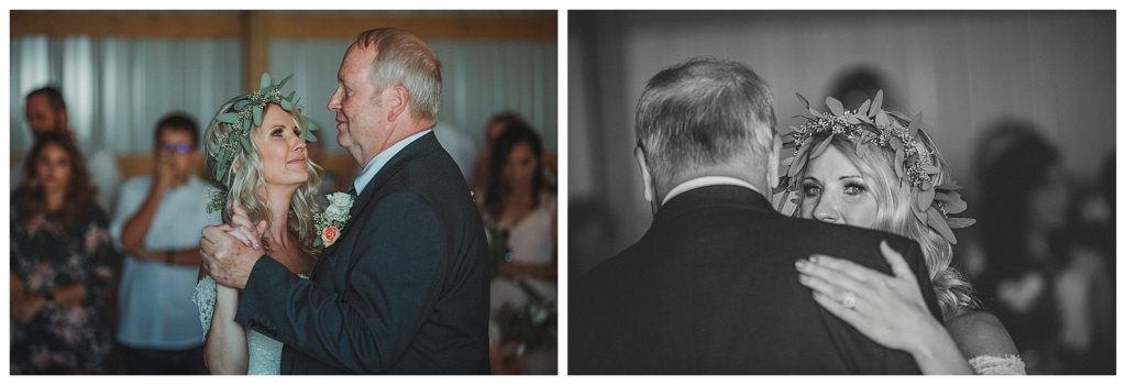 father and daughter dance in barn