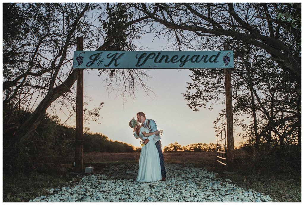 bride and groom dipping at dusk