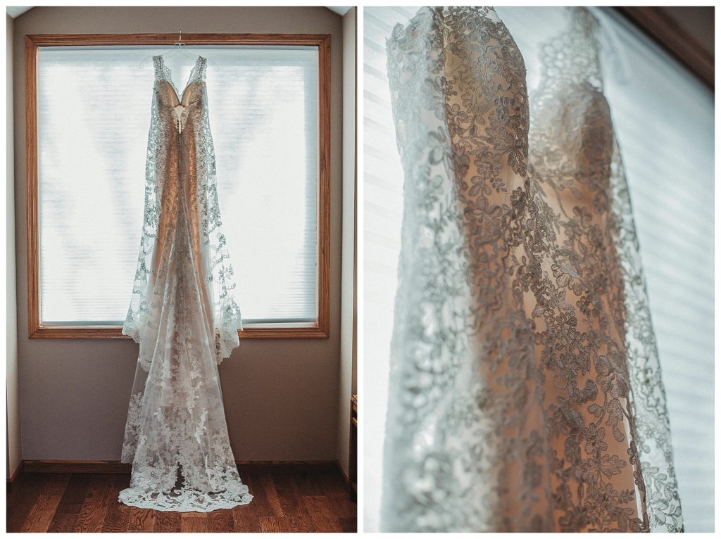 bridal gown hanging on window