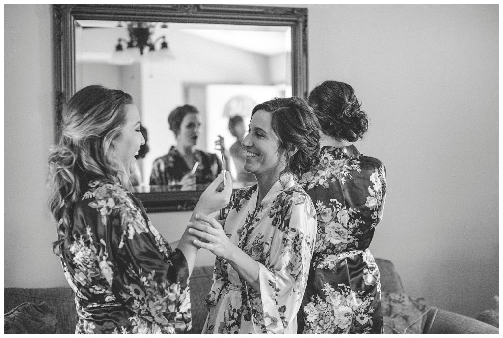 bride laughing with bridesmaid