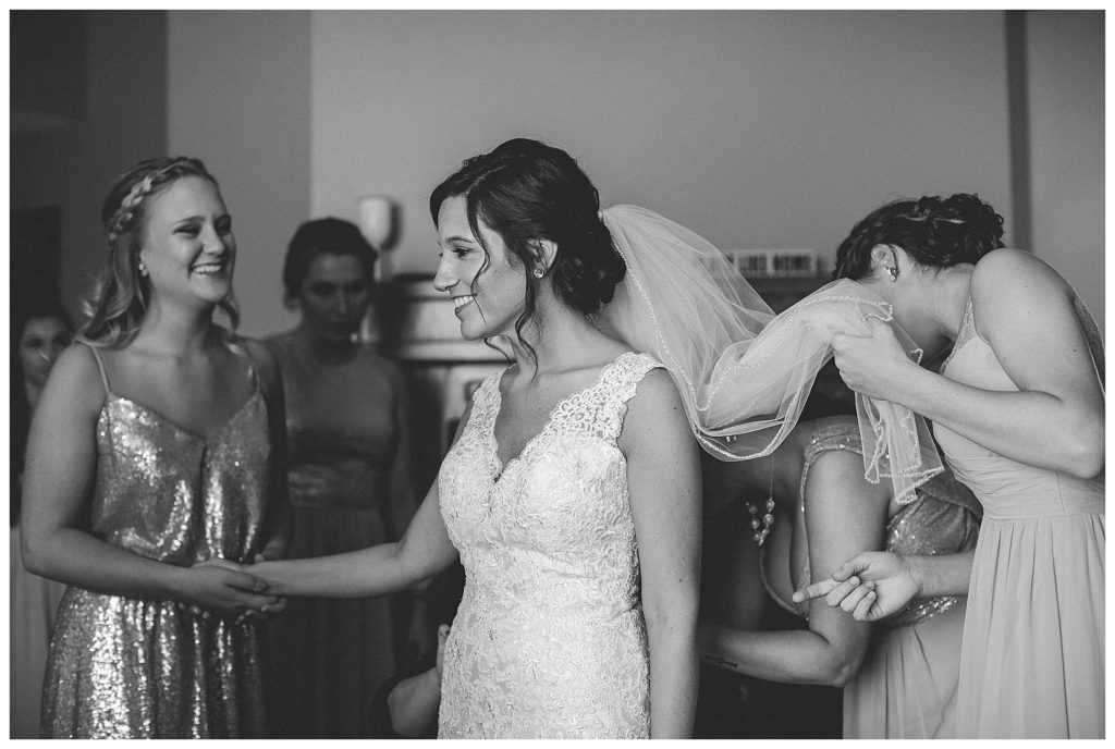 bride having help in her dress