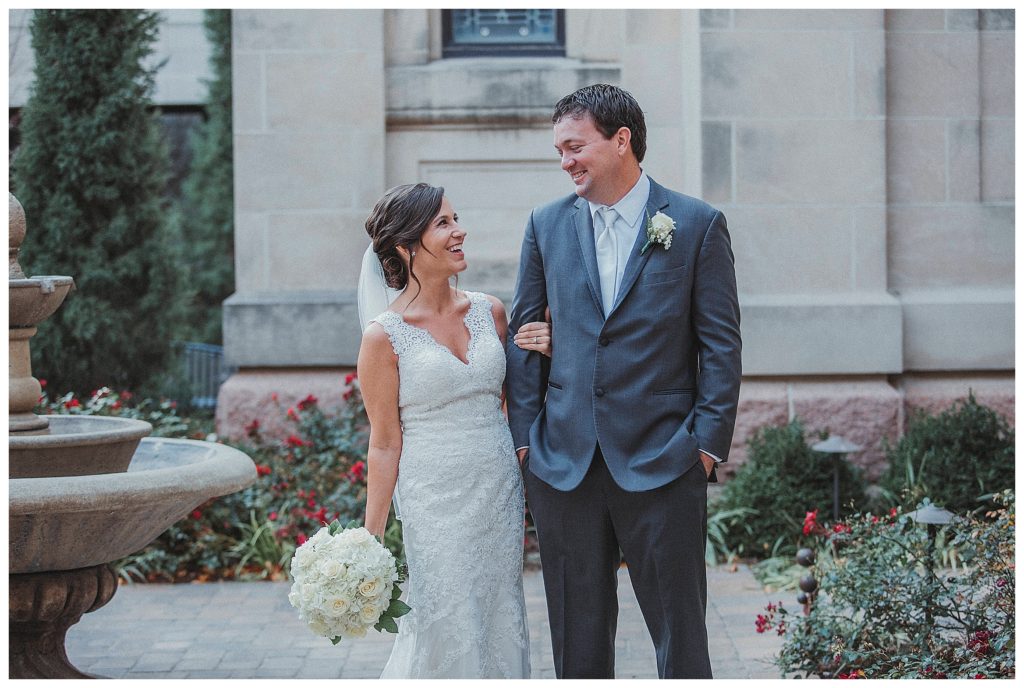 bride and groom laughing together