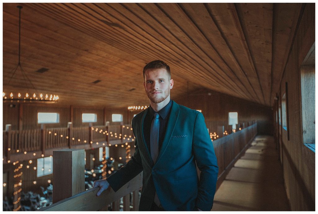 groom in the loft at stone hill barn