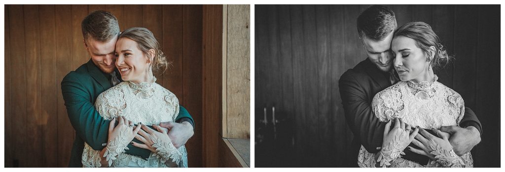bride and groom cuddling near window