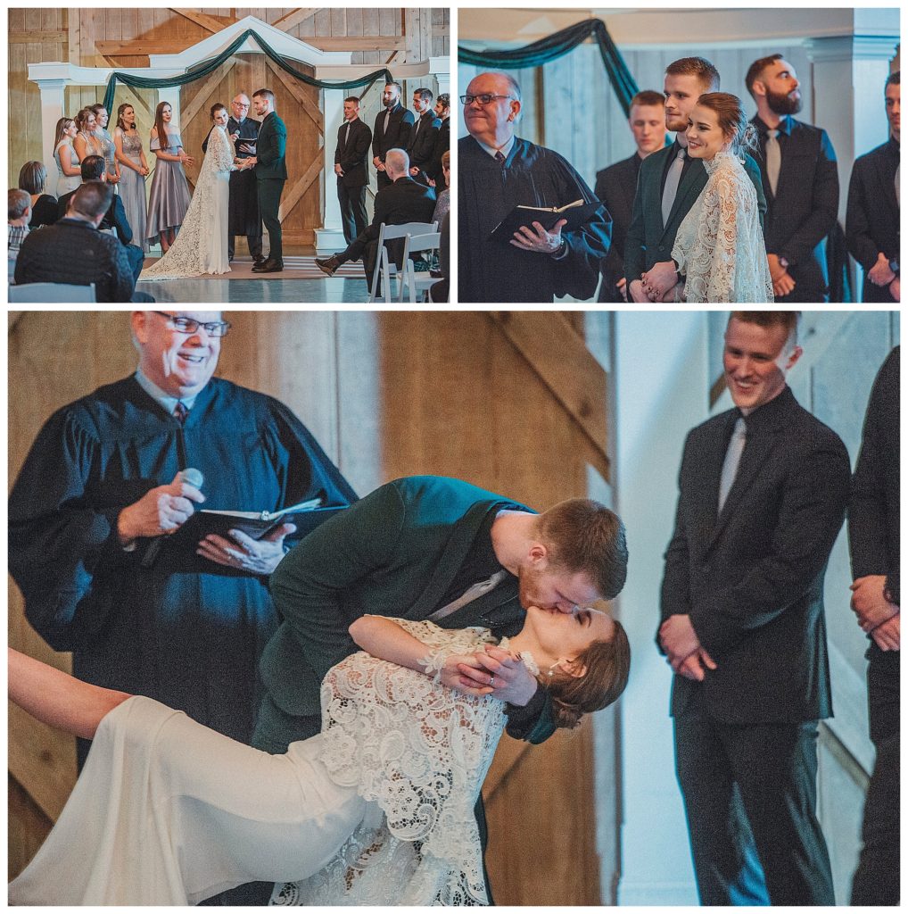 groom kissing his bride during the ceremony