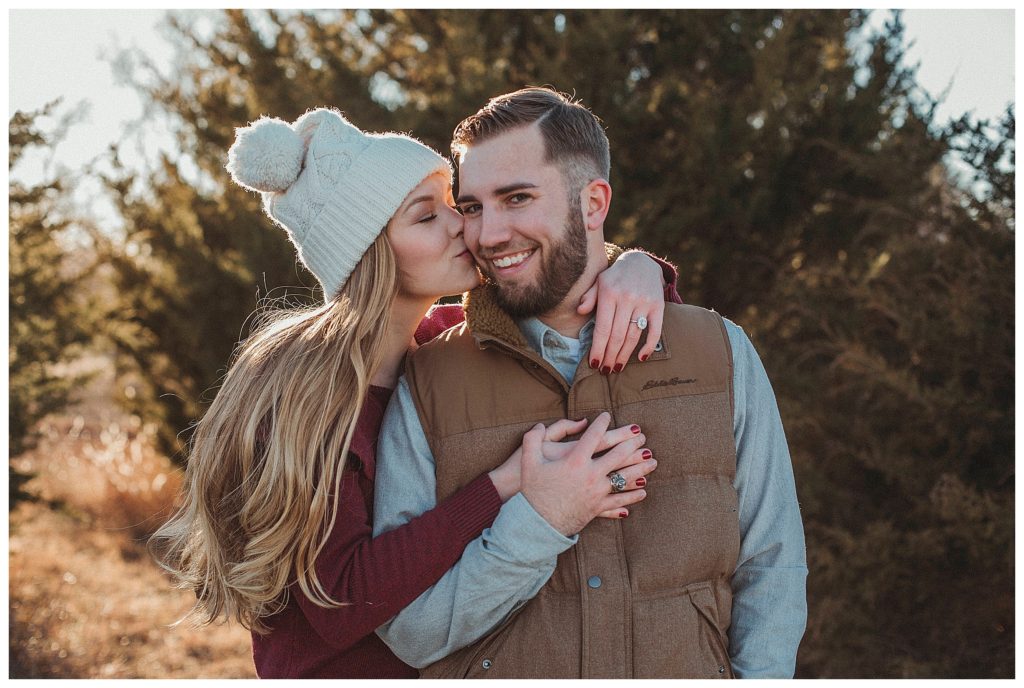 girlfriend giving her boyfriend a kiss on the cheek