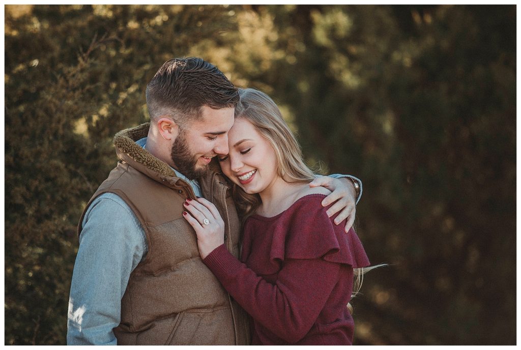 couple snuggling together outside