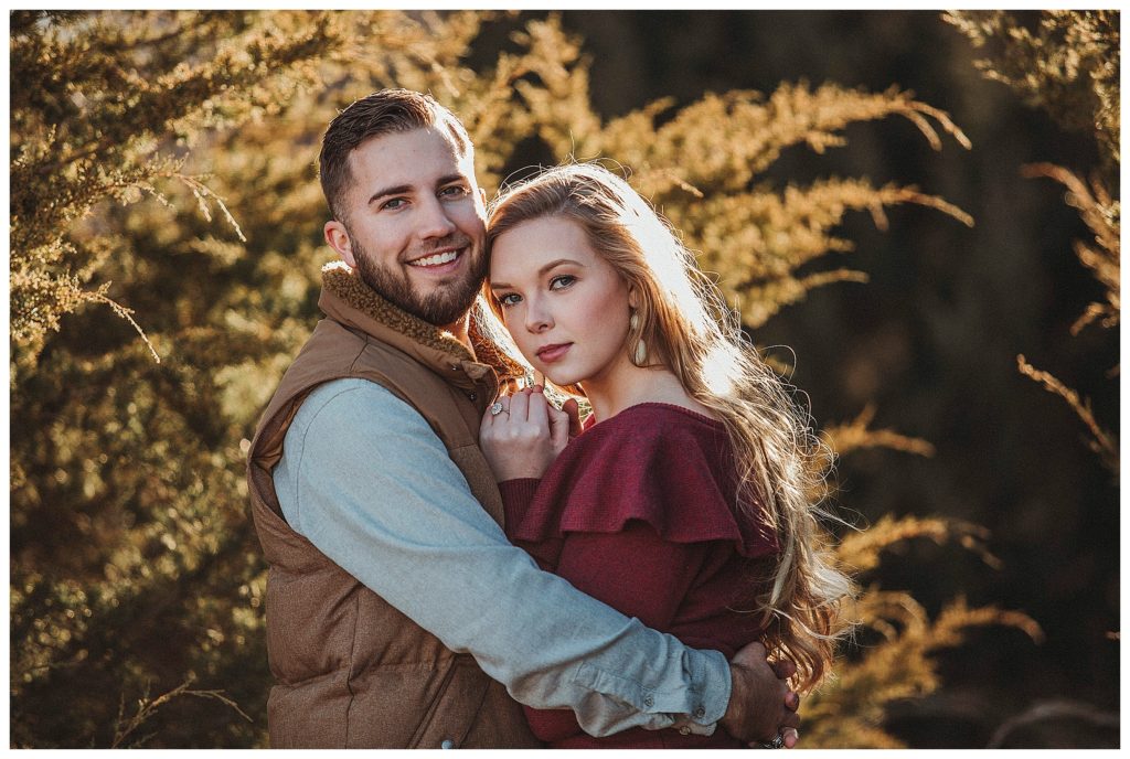 boyfriend keeping his girlfriend warm