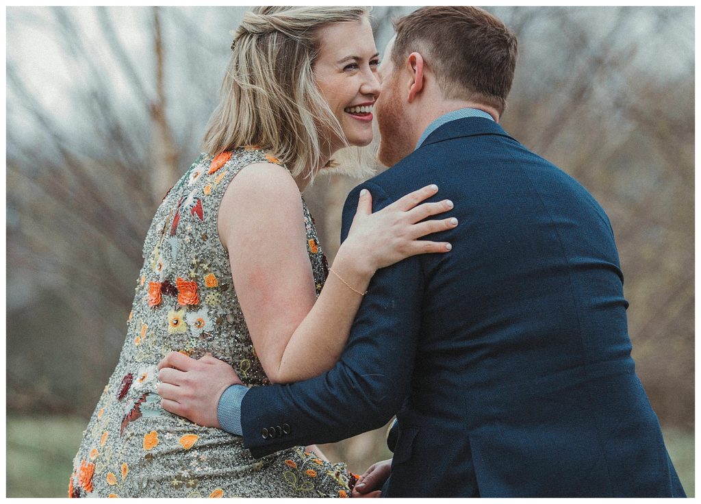 bride wispering in her grooms ear