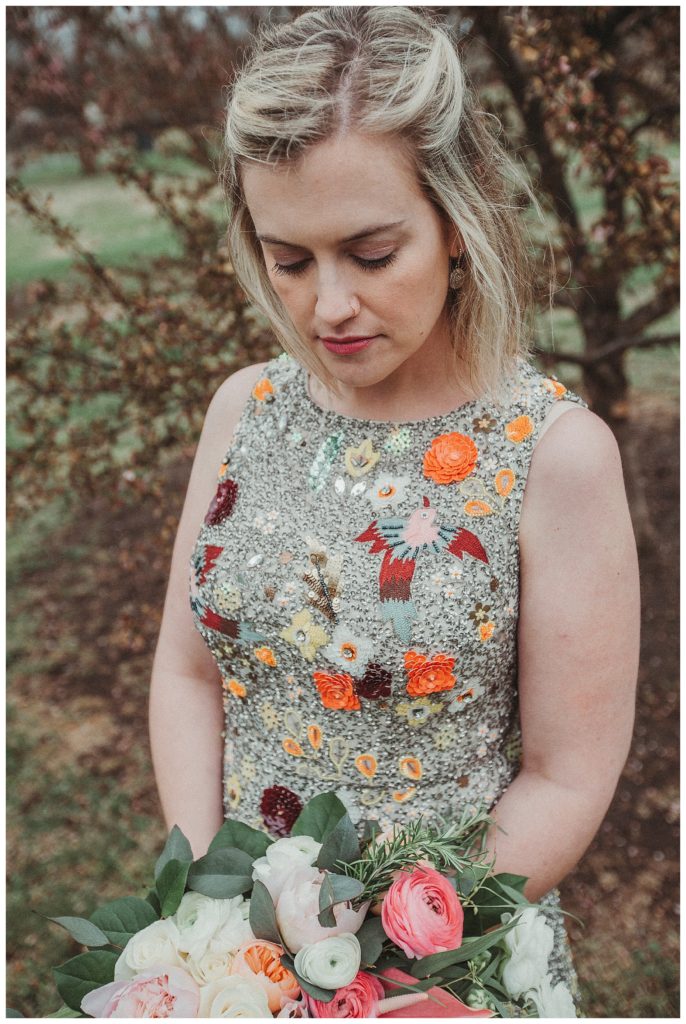 bride looking down at her flowers