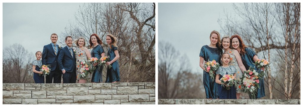 bride with her bridesmaids on a stone bridge