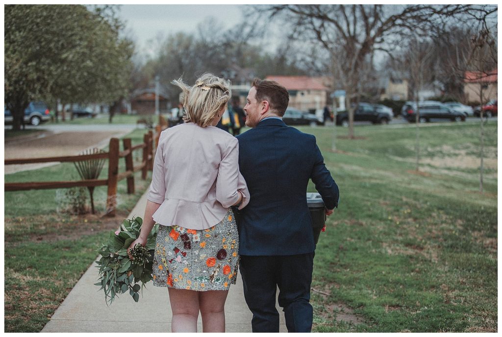 bride and groom walking away together