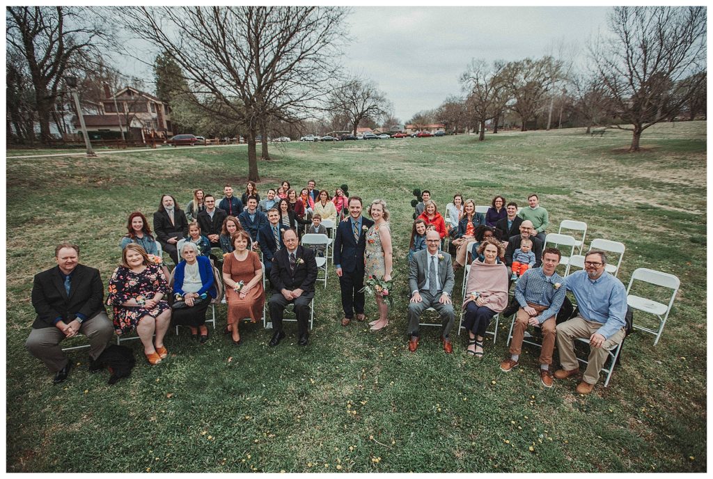 the entire wedding party after the wedding posing for a picture